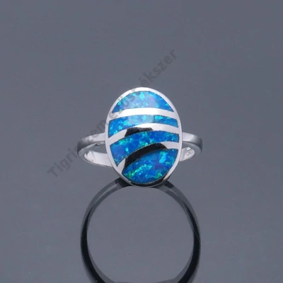 Ezüst  női gyűrű kék opállal ,osztott 53-as